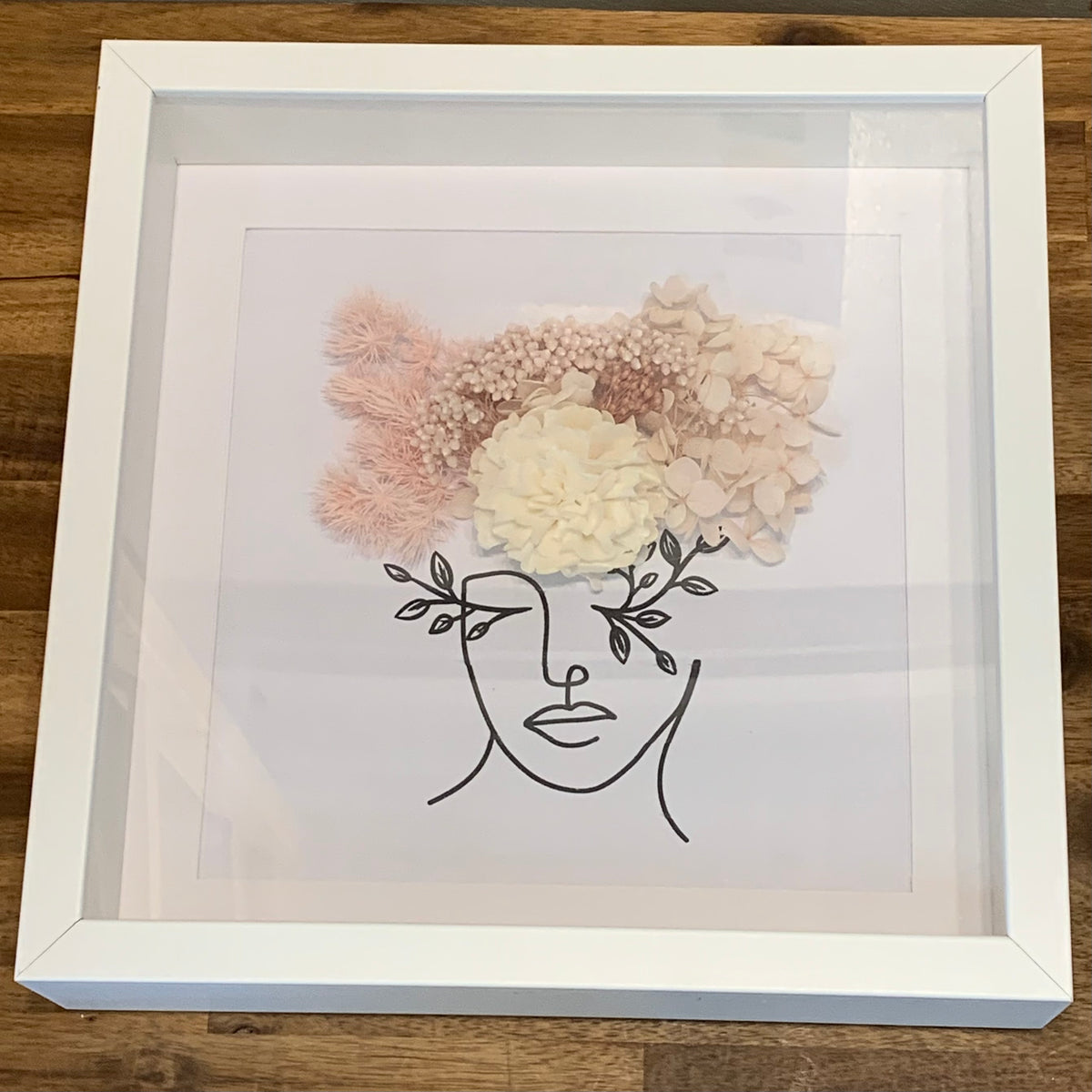 Line drawing with dried flowers in pink